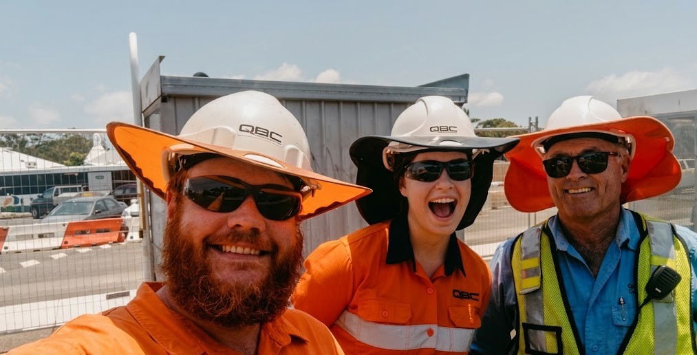 QBC team members together on site - laughs, sunshine and shared pride in the work